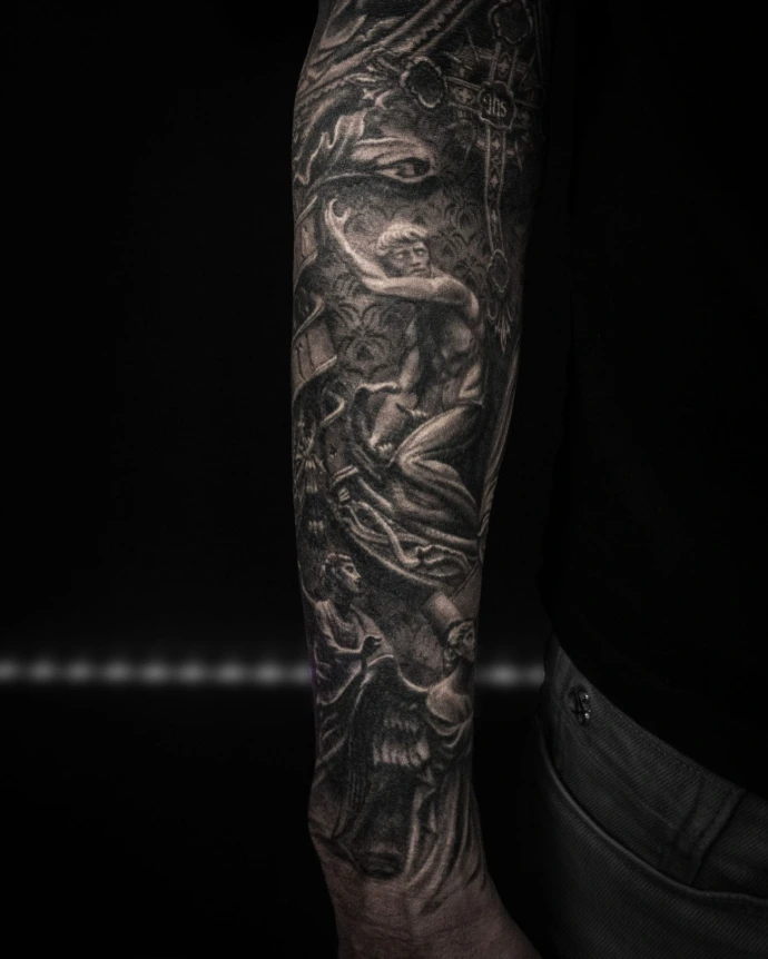 Forearm tattoo of a fallen angel  rendered in a cracked stone statue style.
