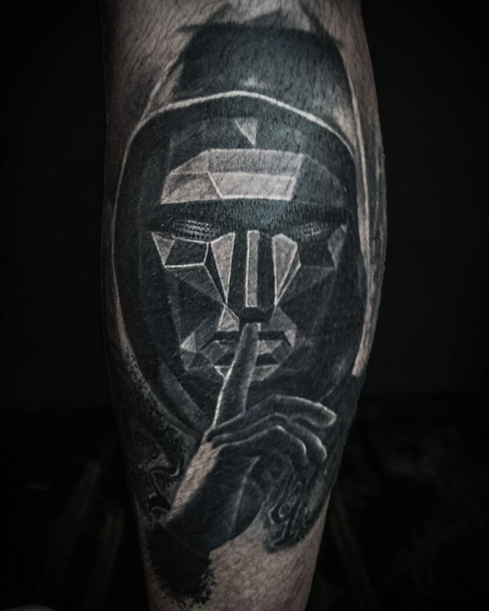 Realistic pop culture tattoo of the Squid Game villain with a geometric mask and textured hood.