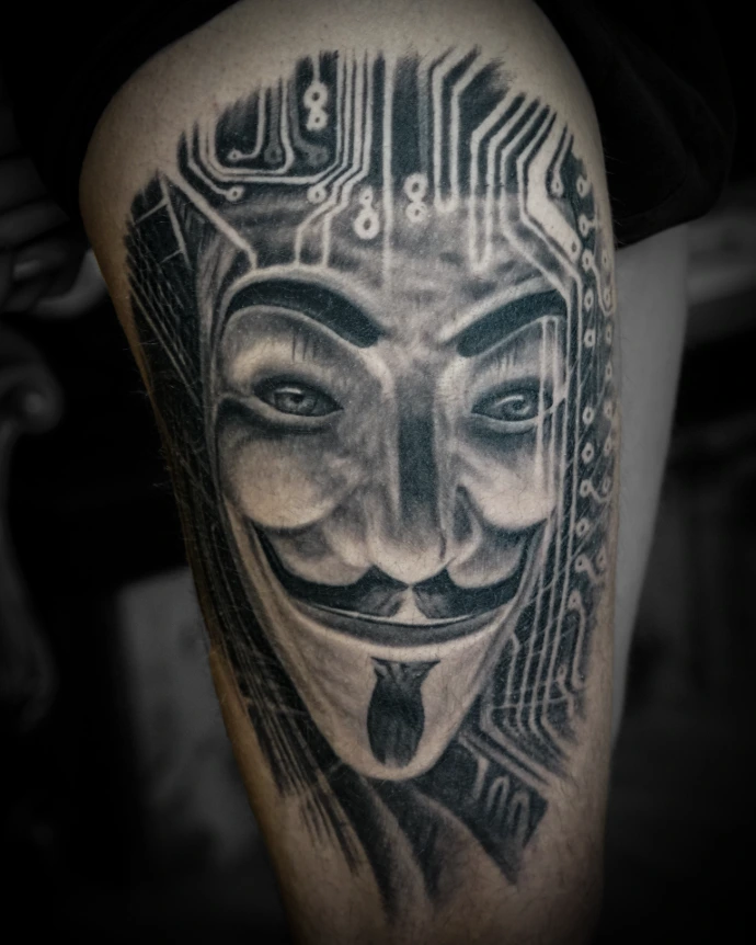 Realistic Anonymous mask tattoo with cybernetic and circuit board details, shading from organic to geometric."  C. Image Title Attribute
